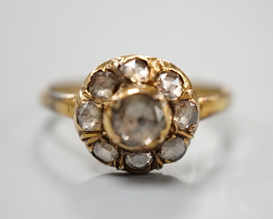 An antique yellow metal and rose cut diamond cluster set ring, size K/L, gross weight 3.2 grams.